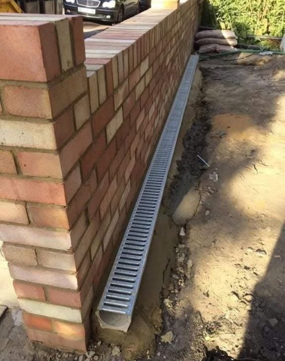 Brick wall and drainage channel